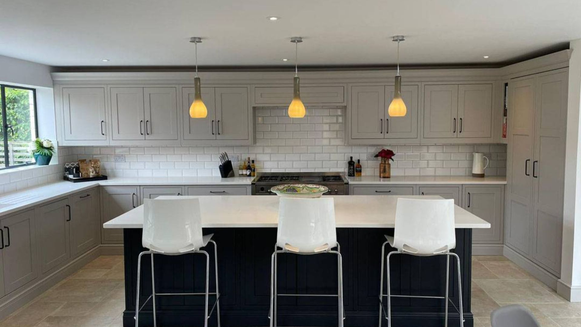 view of back wall in kitchen with island and cooker